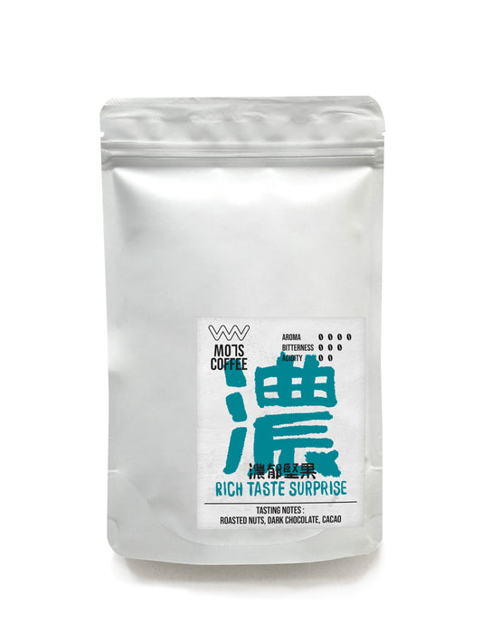 A steaming cup of coffee, radiating nutty richness and velvety dark chocolate notes. Subtle cacao undertones add a luxurious depth, while a whisper of tropical fruit sweetness surprises with a bright twist—every sip is indulgent and full of personality.